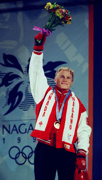 Canada's Ross Rebagliati celebrates after winning the gold medal in the Snowboard event at the 1998 Nagano Olympic Games. (CP Photo/ COA)