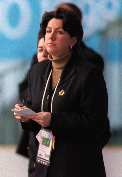Canada's Daniele Sauvageau assistant coach for the women's hockey team, watches her team play at the 1998 Nagano Winter Olympics. (CP PHOTO/COA)