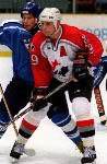 Canada's Steve Yzerman (19) competes in hockey action at the 1998 Winter Olympics in Nagano. (CP Photo/COA/ F. Scott Grant )