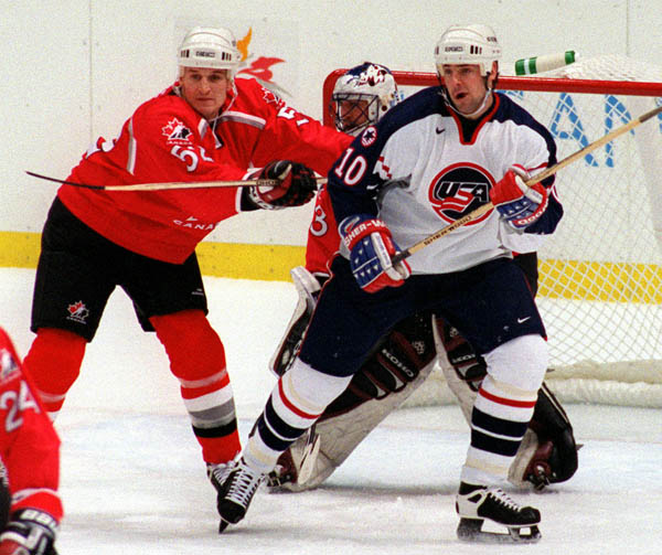 Canada's Adam Foote in action against his opponent at the 1998 Nagano Winter Olympics. (CP PHOTO/COA)