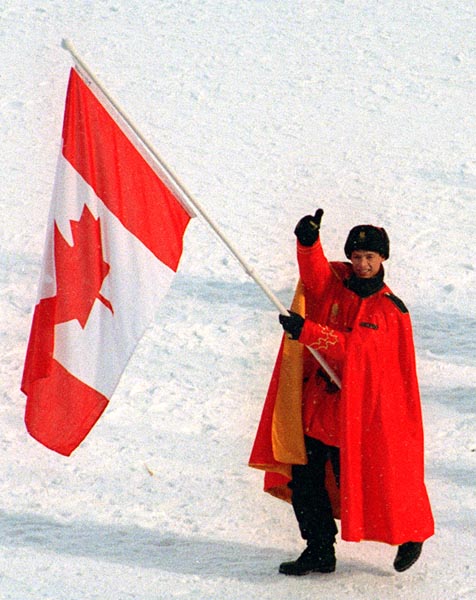Canada's Kurt Browning carries the flag during the opening ceremony at the 1994 Lillehammer Winter Olympics. (CP PHOTO/ COA)