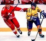 Canada's Brad Werenka (left) and Derek Mayer participate in hockey action at the 1994 Winter Olympics in Lillehammer. (CP Photo/COA/Claus Andersen)