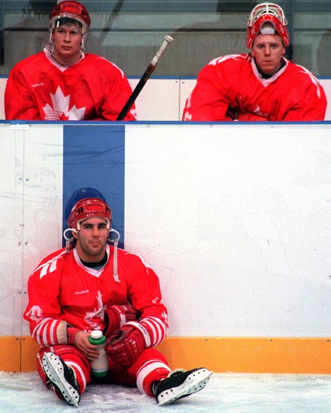 Canada's Paul Kariya (L) Corey Hirsch (R) and Dwayne Norris during the gold medal game which Sweden won 3-2 in a shoot out at the 1994 Lillehammer Winter Olympics. (CP PHOTO/ COA)