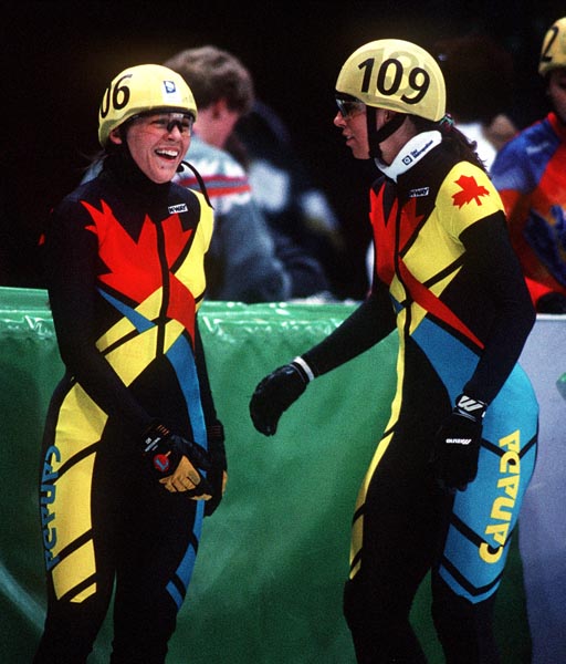 Canada's Isabelle Charest (left) and Nathalie Lambert take a break from competition at the 1994 Lillehammer Winter Olympics. (CP PHOTO/ COA)