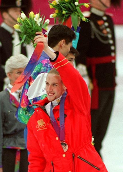 Canada's Marc Gagnon stands on the winners podium after receiving the bronze medal in men's speed skating at the 1994 Lillehammer Winter Olympics. (CP PHOTO/ COA)