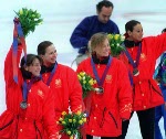 Canada's women's short track relay team (from left) Isabelle Charest, Sylvie Daigle, Christine Boudrias and Nathalie Lambert celebrate their silver medal win at the 1994 Lillehammer Winter Olympics. (CP PHOTO/ COA)