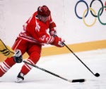 Canada's Greg Parks (left) and Dwayne Norris participate in hockey action at the 1994 Winter Olympics in Lillehammer. (CP Photo/COA/Claus Andersen)