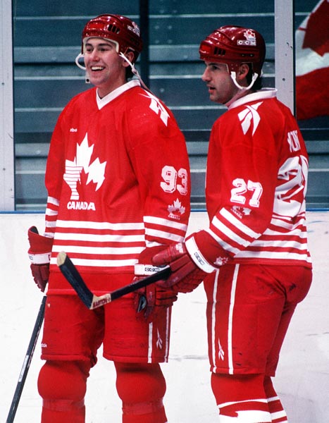 Canada's Peter Nedved (left) and Chris Kontos during a break in game play at the 1994 Lillehammer Winter Olympics. (CP PHOTO/ COA)