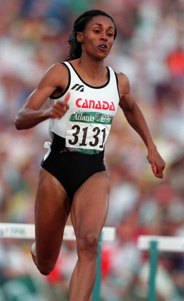 Canada's Rosey Edeh competing in the 400m hurdles event at the 1996 Atlanta Summer Olympic Games.(CP PHOTO/COA/Claus Andersen)