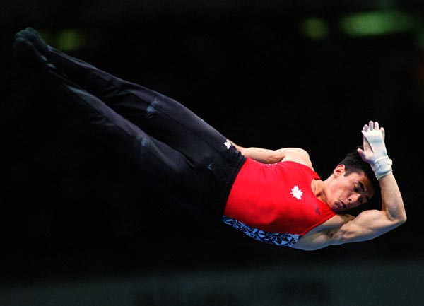 Canada's Richard Ikeda competing in the gymnastics event at the 1996 Atlanta Summer Olympic Games. (CP PHOTO/COA/Scott Grant)