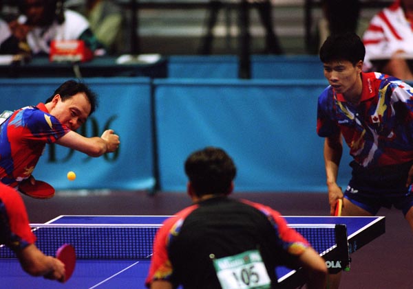Canada's Johnny Huang (right) and Joe Ng in action against their opponents during the table tennis event at the 1996 Atlanta Summer Olympic Games. (CP PHOTO/COA/Scott Grant)