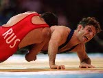 Canada's Paul Ragusa (right) competes in the wrestling event at the 1996 Atlanta Olympic Games. (CP Photo/COA/Mike Ridewood)