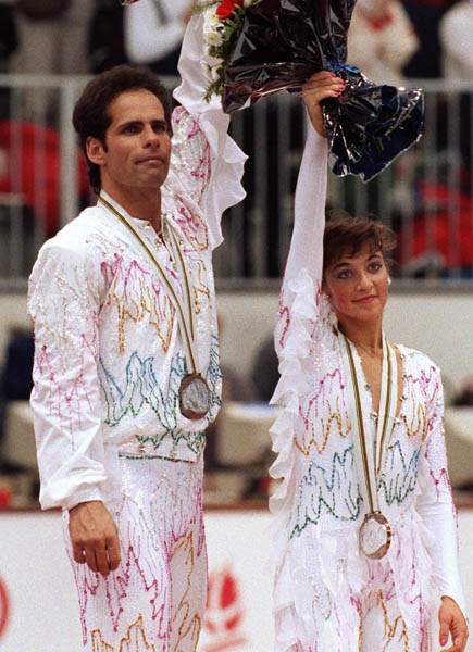 Canada's Lloyd Eisler and Isabelle Brasseur celebrate their bronze medal win at the 1992 Albertville Olympic winter Games. (CP PHOTO/COA/Scott Grant)