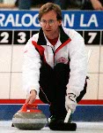 Canadian men's curling lead Don Bartlett tries to place his stone. Canadian Team lost  6 - 5 in the gold medal game against Norway during the 2002 Olympic Winter Games at Ogden, Utah, Friday Feb. 22, 2002 . (CP PHOTO/COA/Mike Ridewood).