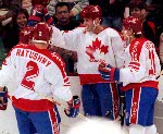 Canada's Dan Ratushny (left) Eric Lindros (centre) and  Chris Lindberg (right) competing in the hockey event against Norway at the 1992 Albertville Olympic winter Games. (CP PHOTO/COA/Scott Grant)