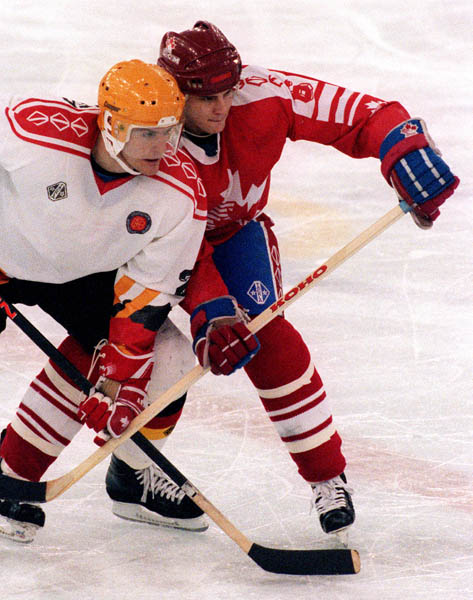 Canada's Kevin Dahl (right) competing in the hockey event against Germany at the 1992 Albertville Olympic winter Games. (CP PHOTO/COA/Scott Grant)