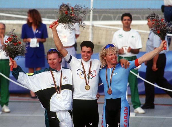 Canada's Curt Harnett (bronze) celebrates the bronze medal he won in the track event at the 1992 Olympic games in Barcelona. (CP PHOTO/ COA/ Claus Andersen)