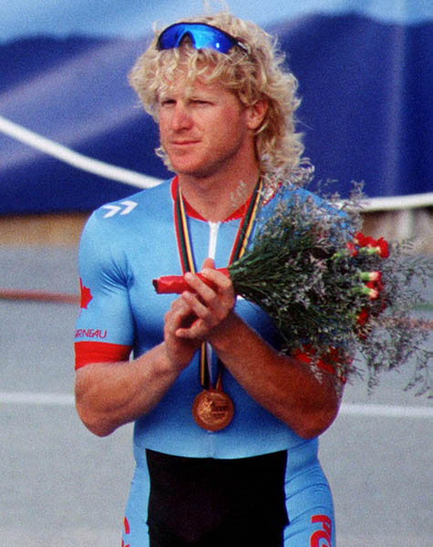 Canada's Curt Harnett celebrates the bronze medal he won in the track event at the 1992 Olympic games in Barcelona. (CP PHOTO/ COA/ Claus Andersen)