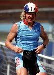 Canada's Curt Harnett the bronze medal he won in the track event at the 1992 Olympic games in Barcelona. (CP PHOTO/ COA/ Claus Andersen)