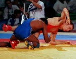 Canada's Marty Calder (red) competing in the wrestling event at the 1992 Olympic games in Barcelona. (CP PHOTO/ COA/ Ted Grant)