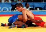 Canada's Marty Calder (red) competing in the wrestling event at the 1992 Olympic games in Barcelona. (CP PHOTO/ COA/ Ted Grant)