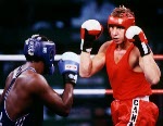 Canada's Tom Glesby (right) competing in the boxing event at the 1992 Olympic games in Barcelona. (CP PHOTO/ COA/ F.S.Grant)
