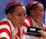 Canada's Penny and Vicky Vilagos, identical twins, and their coach Denise sauve competing in the synchronized swimming event at the 1992 Olympic games in Barcelona. (CP PHOTO/ COA/ Ted Grant)