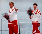 Canada's Eric Jesperson (upper left) and Ross MacDonald (upper right) celebrate the bronze medal they won in the yachting event at the 1992 Olympic games in Barcelona. (CP PHOTO/ COA/ F.S.Grant)