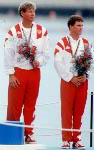 Canada's Eric Jesperson (upper left) and Ross MacDonald (upper right) celebrate the bronze medal they won in the yachting event at the 1992 Olympic games in Barcelona. (CP PHOTO/ COA/ F.S.Grant)