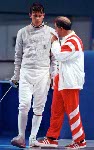 Canada's  Leszek Nowosielski (left) and coach Henri Sassine competing in the fencing event at the 1992 Olympic games in Barcelona. (CP PHOTO/ COA/ T.Grant)