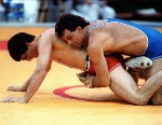 Canada's Chris Rinke (blue) competing in the wrestling event at the 1988 Olympic games in Seoul. (CP PHOTO/ COA/ Cromby McNeil)