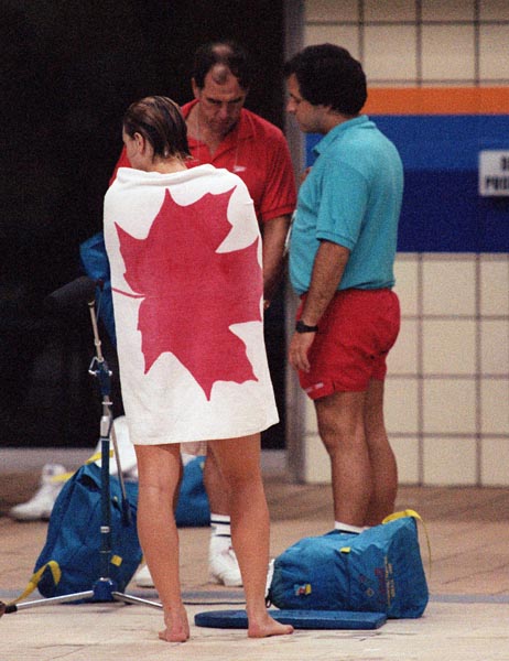Canada's Andrea Nugent and coaches Dave Johnson (right) and Trevor Tiffany (centre)  competing in the swimming event at the 1988 Olympic games in Seoul. (CP PHOTO/ COA/ Cromby McNeil)