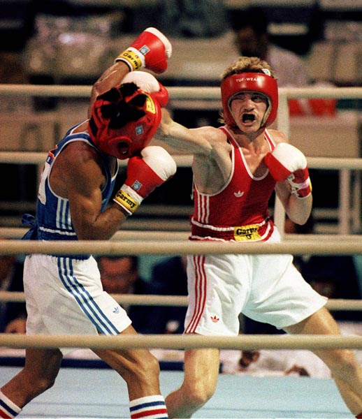 Canada's Jamie Pagendam (right) competing in the boxing event at the 1988 Olympic games in Seoul. (CP PHOTO/ COA/ S.Grant)
