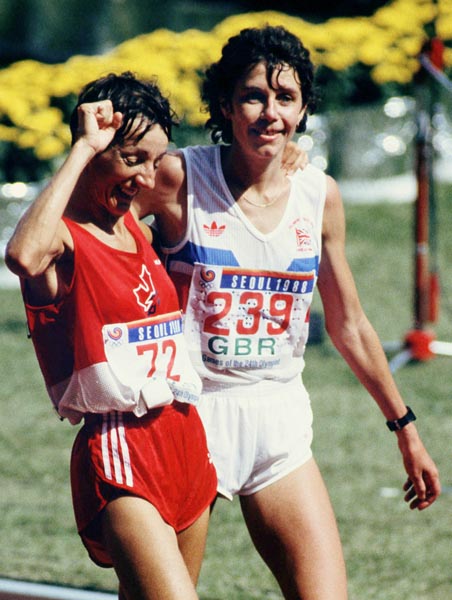 Canada's Odette Lapierre (left) with Great Britain's Angela Pain after completing the marathon event at the 1988 Olympic games in Seoul. (CP PHOTO/ COA/F.S.Grant)