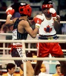 Canada's Ray Downey (right) in action against his opponent Si-Hun Park from Korea at the 1988 Olympic Games in Seoul. (CP Photo/ COA/F.S.Grant)
