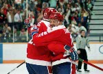Canada's Andy Moog (#35), Robert Joyce (#15), Zarley Zalapski (#25) and Steven Tambellini (#11) participate in the hockey event at the 1988 Winter Olympics in Calgary. (CP PHOTO/COA/S.Grant)