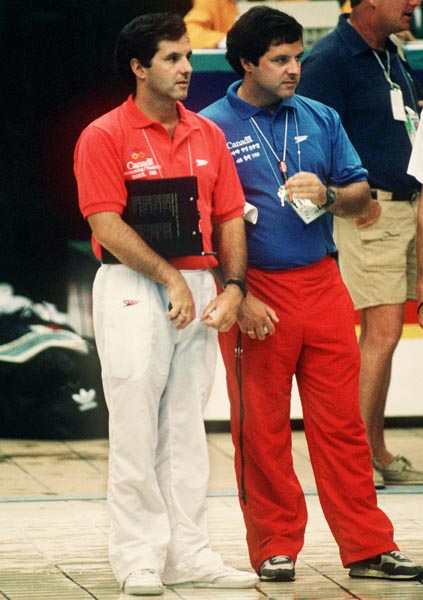 Canadian swim team coaches Tom Johnson (left) and Dave Johnson during the swimming event at the 1988 Olympic games in Seoul. (CP PHOTO/ COA/ Cromby McNeil)