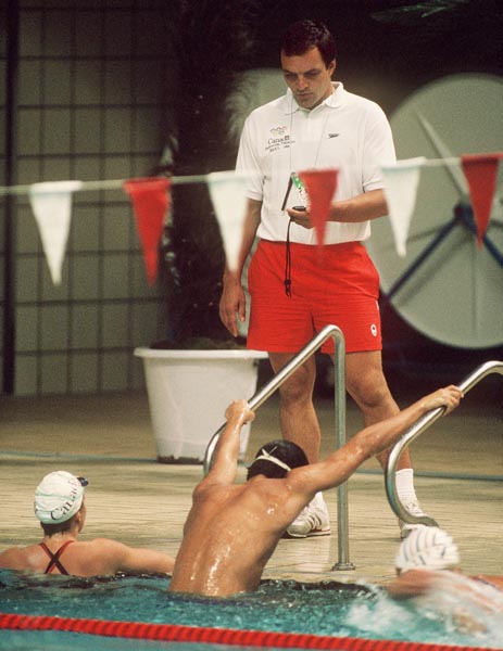Canada's Alain Lefebvre checks times on his stop-watch during the swimming event at the 1988 Olympic games in Seoul. (CP PHOTO/ COA/ Cromby McNeil)
