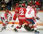 Canada's Wallace Schreiber (#7), Brian Bradley (#8) and Claude Vilgrain (behind)  participate in the hockey event at the 1988 Winter Olympics in Calgary. (CP PHOTO/COA/S.Grant)