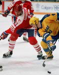 Canada's Andy Moog (#35), Robert Joyce (#15), Zarley Zalapski (#25) and Steven Tambellini (#11) participate in the hockey event at the 1988 Winter Olympics in Calgary. (CP PHOTO/COA/S.Grant)