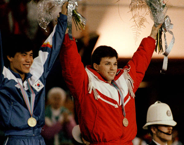 Canada's Michel Daignault (right) celebrates his bronze medal win in the speedskating event at the 1988 Winter Olympics in Calgary. (CP PHOTO/COA/T. O'lett)