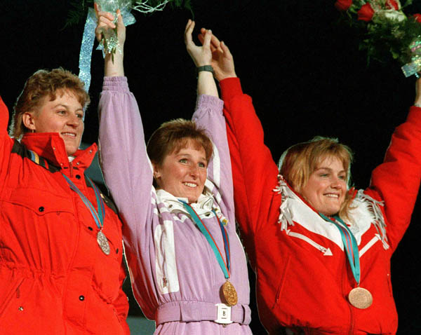 Canada's Karen Percy (right) celebrates her bronze medal win in the alpine ski event along with Silver medalist Brigitte Oertli (left) and gold medalist Alarina Kiehl (centre) at the 1988 Winter Olympics in Calgary. (CP PHOTO/ COA/C. McNeil)