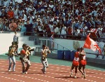 Canada's Ben Johnson (right) concentrates on the starting blocks for the 100m event at the 1988 Olympic games in Seoul. (CP PHOTO/ COA/ Cromby McNeil)