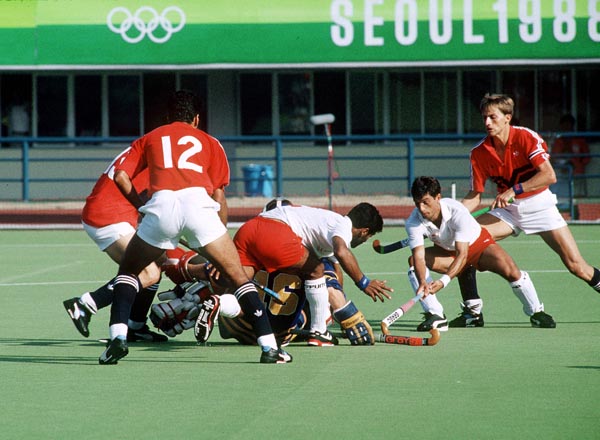 Canada's Hargurnek Sandho (left) and Pat Caruso (right) play field hockey at the 1988 Seoul Olympic Games. (CP Photo/ COA/ T. Grant)