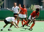 Canada's Satinder Chohan (centre) and Hargurnek Sandhu (right) play field hockey at the 1988 Seoul Olympic Games. (CP Photo/ COA/ T. Grant)