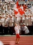 Canada's Carolyn Waldo carries the Canadian flag during the opening ceremonies at the 1988 Olympic games in Seoul. (CP PHOTO/ COA/ Cromby McNeil)
