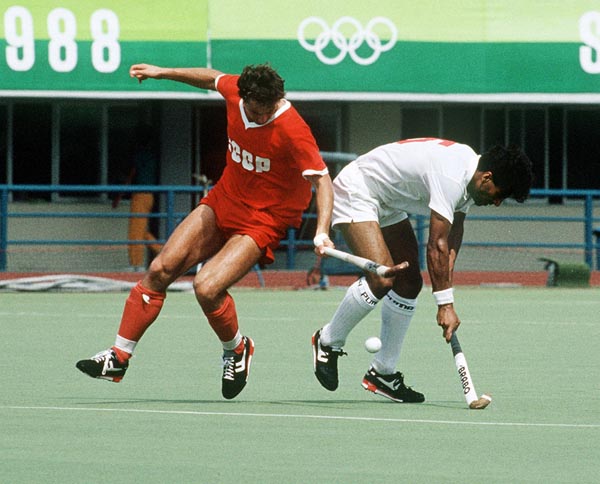 Canada's Satinder Chohan (right) plays field hockey at the 1988 Seoul Olympic Games. (CP Photo/ COA/ T. Grant)