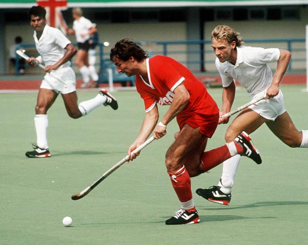 Canada's Satinder Chohan (left) and Michael Muller play field hockey at the 1988 Seoul Olympic Games. (CP Photo/ COA/ T. Grant)