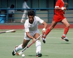Canada's Pat Burrows (in front) and Hargurnek Sandhu play field hockey at the 1988 Seoul Olympic Games. (CP Photo/ COA/ T. Grant)