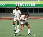 Canada's Satinder Chohan (centre) and Hargurnek Sandhu (right) play field hockey at the 1988 Seoul Olympic Games. (CP Photo/ COA/ T. Grant)